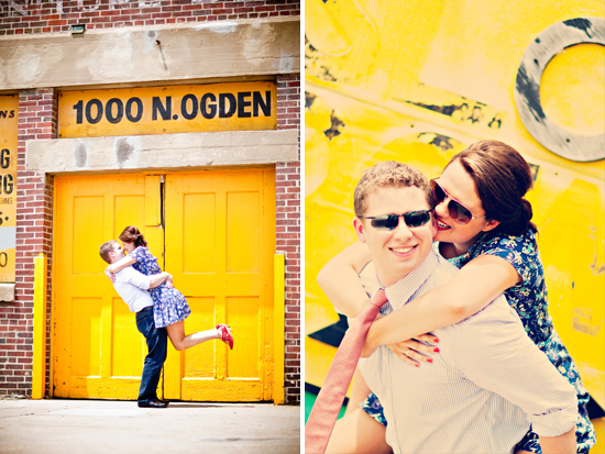 Couple embraces near yellow door; joyful engagement photo