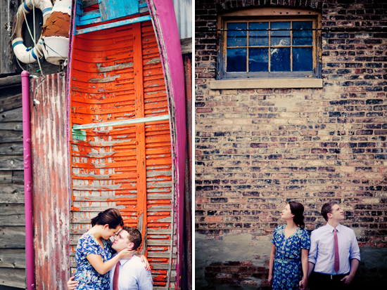 Romantic couple embraces by rustic boat and brick wall