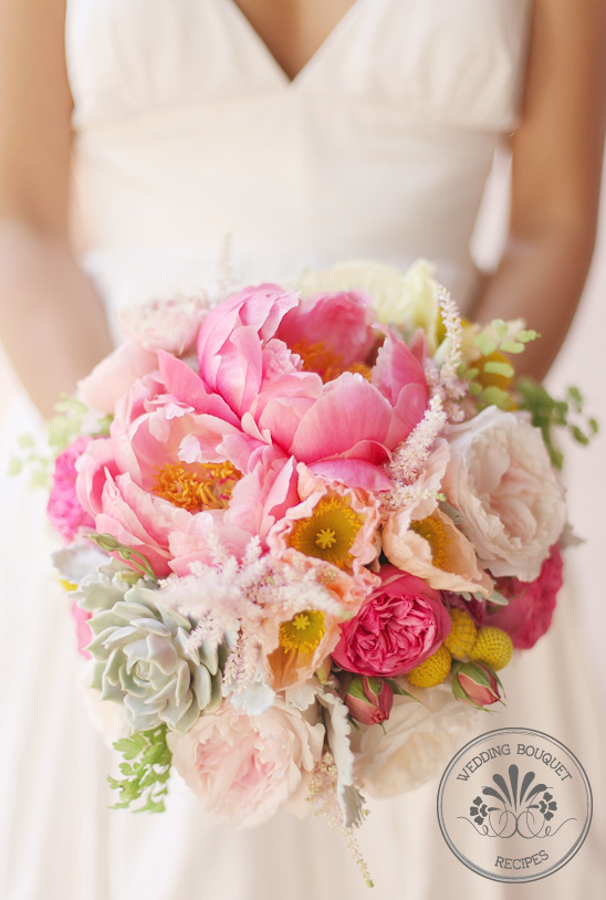 Bride holding a beautiful pink wedding bouquet