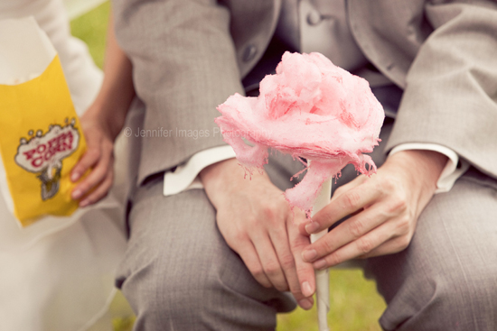 Pink cotton candy held by hands