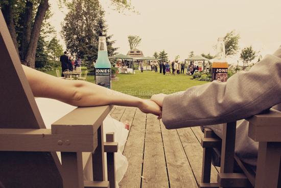 Couple holding hands at wedding reception
