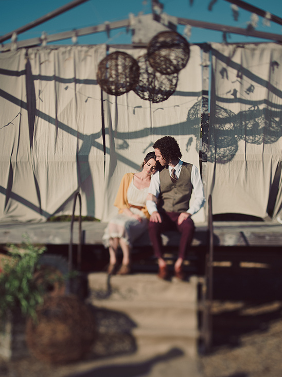 Romantic couple embracing under outdoor decor