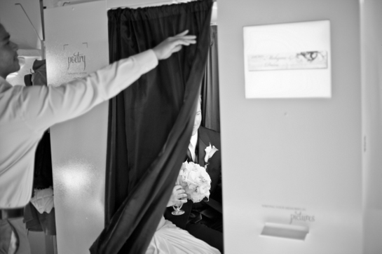 Couple taking photo booth pictures