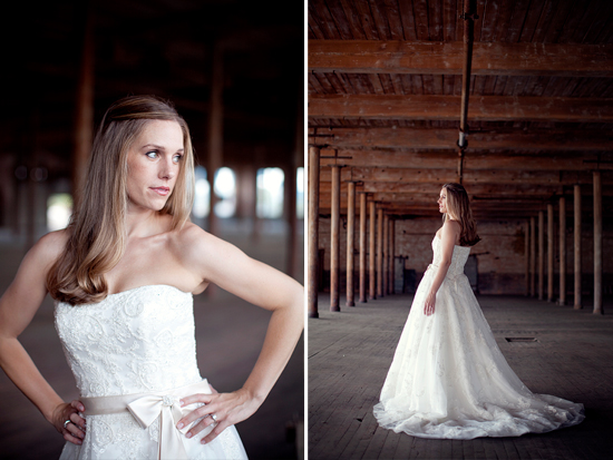 Bride in elegant lace wedding gown in rustic setting