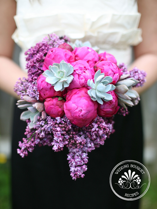 Pink peony lilac and succulent wedding bouquet held
