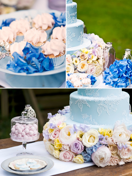 Pastel blue cake and cupcakes with flowers
