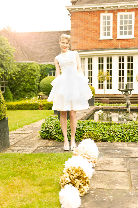 Woman in white dress, garden setting