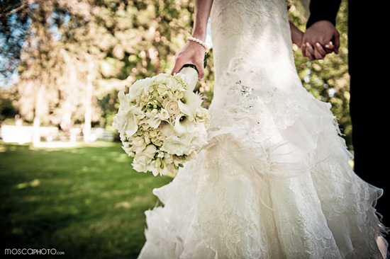Bride holding elegant white wedding bouquet