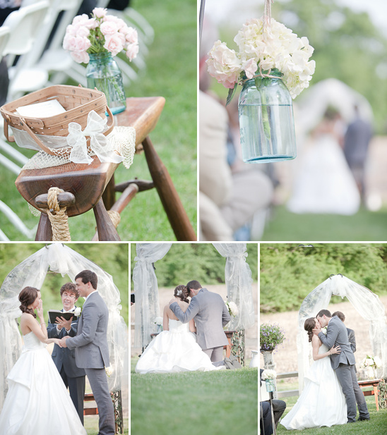 Rustic wedding ceremony decorations and couple kissing