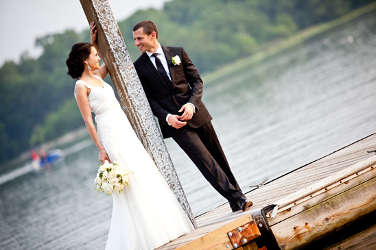 Happy couple on a dock, wedding photo