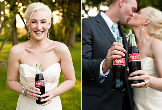 Bride and groom toasting with coca-cola bottles