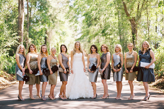Bride and bridesmaids in gray dresses outdoors
