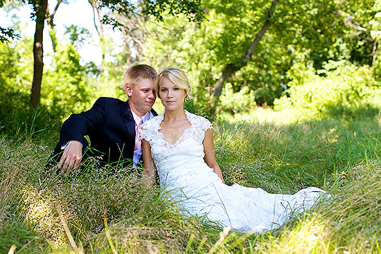 Happy bride and groom in a field