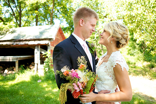 Bride and groom smile tenderly on wedding day