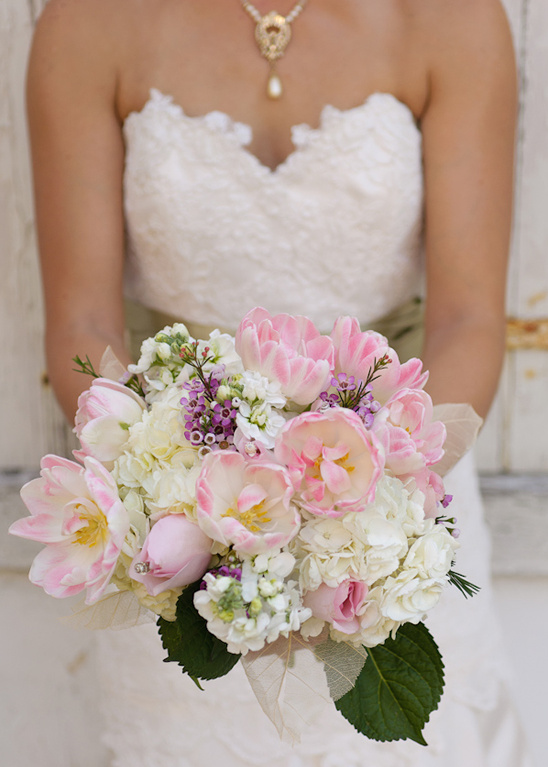 Bride holding beautiful pink and white wedding bouquet