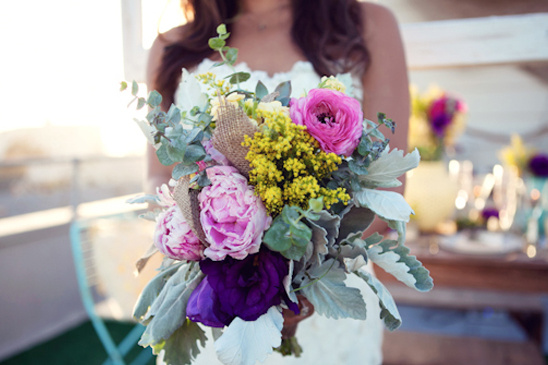 Colorful wedding bouquet with pinks purples and yellows