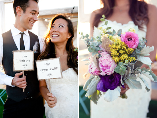 Happy couple holding wedding signs