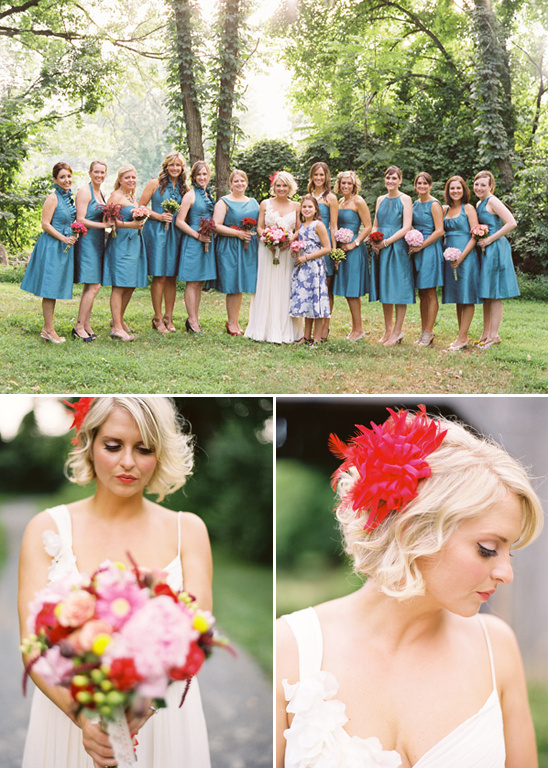 Bride with bridesmaids in teal dresses and a red flower
