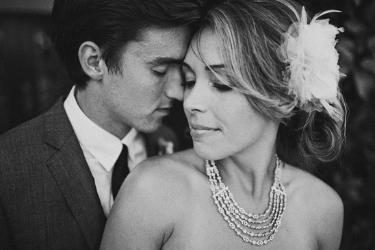 Black and white photo of a loving wedding couple