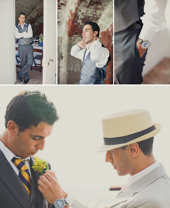 Groom in a gray vest suit and hat getting ready