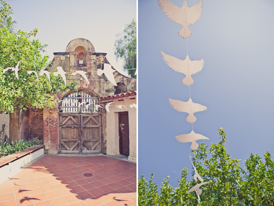 Paper birds strung overhead,  wedding decor