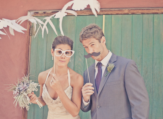 Couple wedding photo booth fun glasses mustache