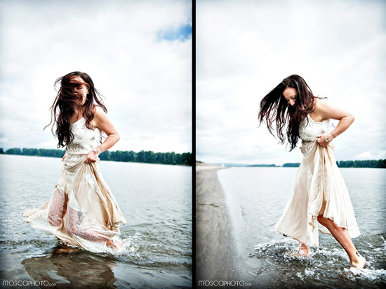 Woman in flowing dress walking in water at the beach