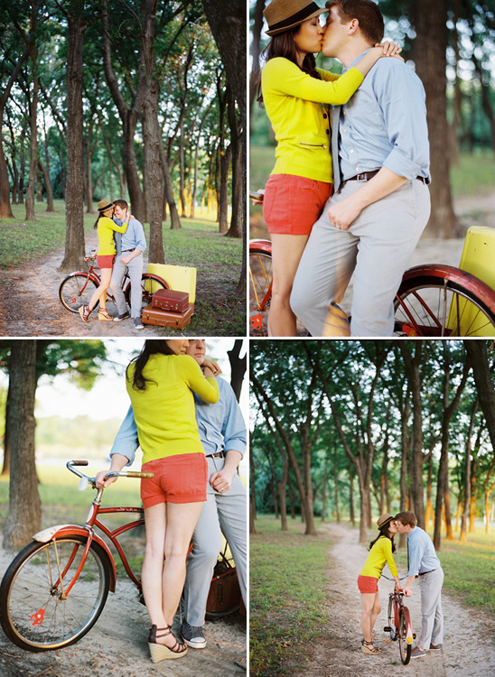 Romantic couple embracing near a red bicycle in the park