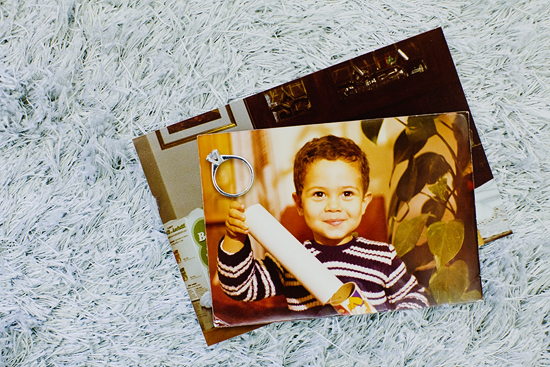 Vintage photo with a child holding a diploma, plus a ring