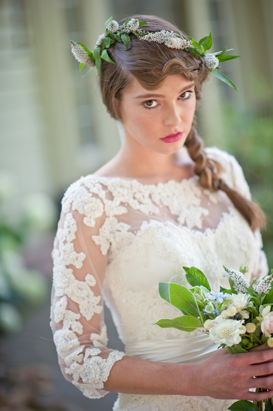 Elegant bride in a lace wedding dress with floral headpiece
