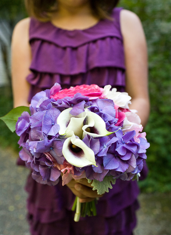 Woman holding a beautiful purple and pink floral bouquet