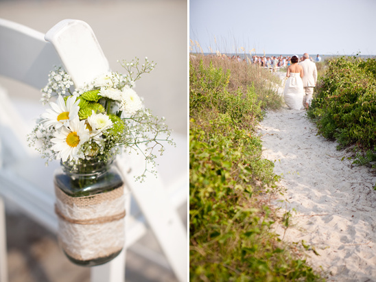 Beach wedding ceremony with flower decor and bride walking aisle