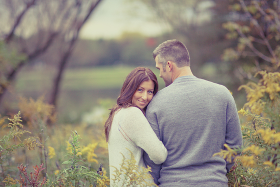Happy couple embrace outdoors in a beautiful autumnal scene