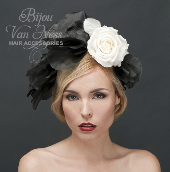 Elegant woman in headpiece with black and white flower accents