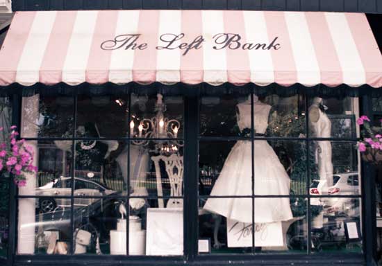 A vintage fashion boutique, The Left Bank, with pink striped awning