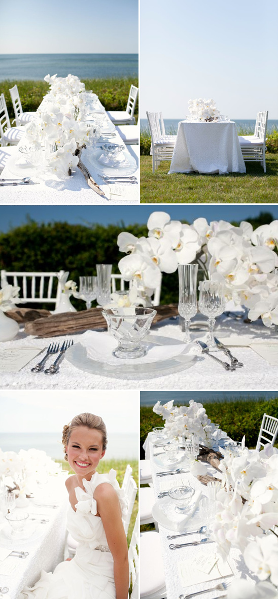 Elegant white wedding table setting with orchids and ocean view