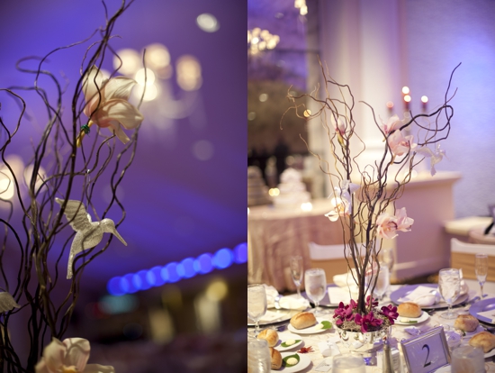 Elegant wedding centerpiece with orchids and decorative birds