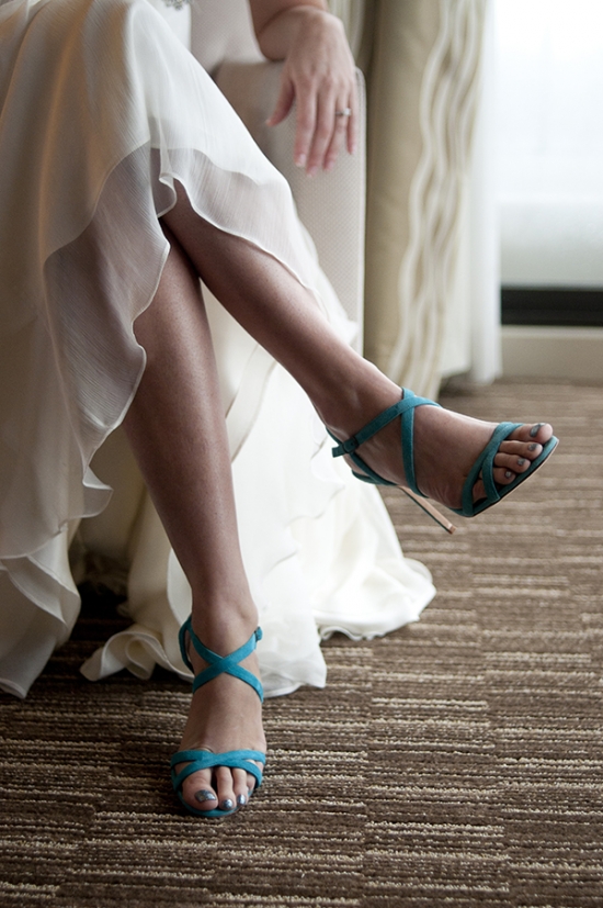 Bride wearing a white dress and stylish turquoise sandals