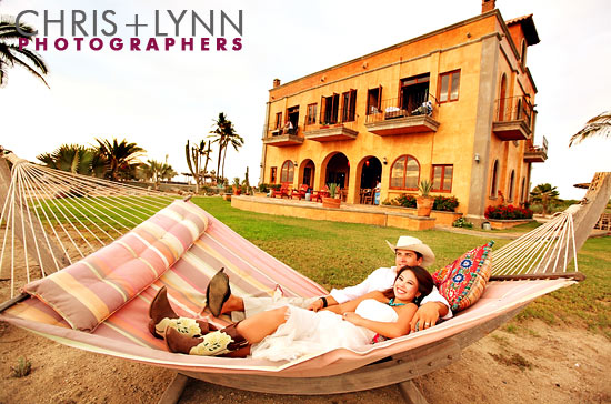 Romantic couple relaxing in a hammock at a villa wedding