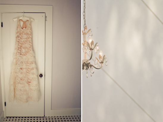 Lace wedding dress and chandelier in a bridal suite