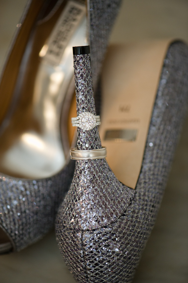 Wedding rings on sparkly silver heels close up shot