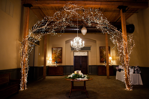 Elegant wedding venue entrance with twinkling fairy lights and chandelier