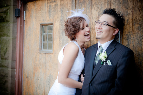 Happy couple laughing on their wedding day, a joyous moment