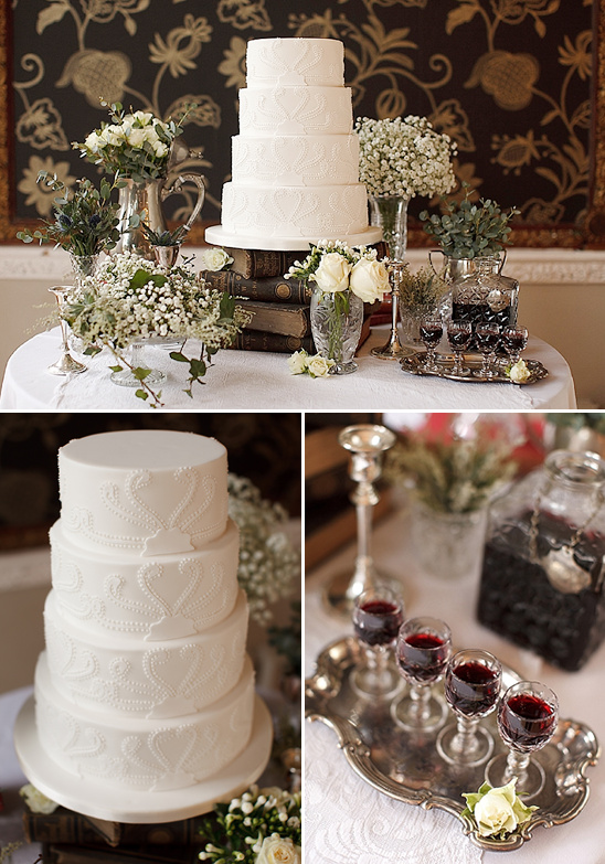 Elegant wedding cake with flowers and drinks on a table