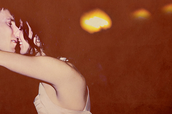 A romantic moment captured in a soft-lit embrace