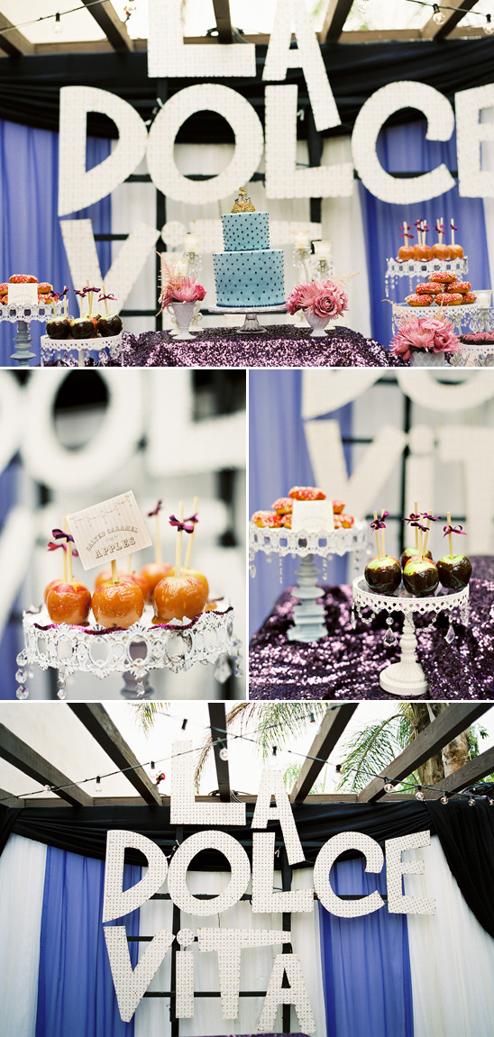 La Dolce Vita party dessert table with cakes and candy apples