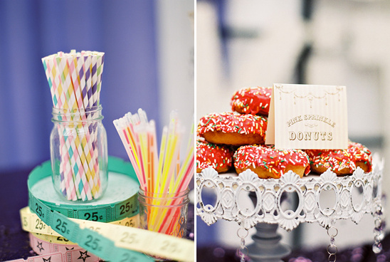 Colorful striped straws and pink sprinkled donuts
