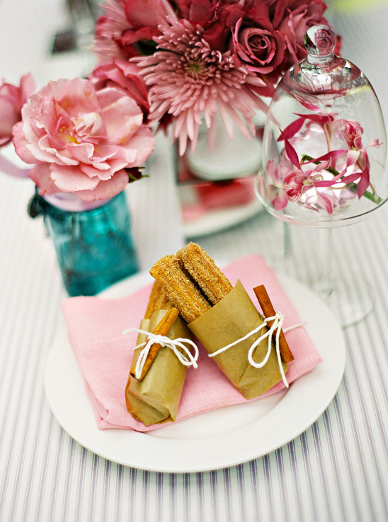 Churros tied with cinnamon sticks floral table decor