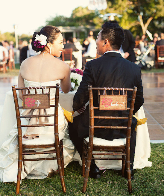 Bride and groom chairs at outdoor wedding