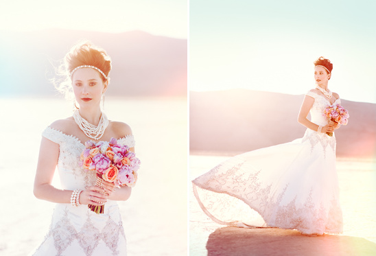 Bride in lace dress holding colorful wedding bouquet